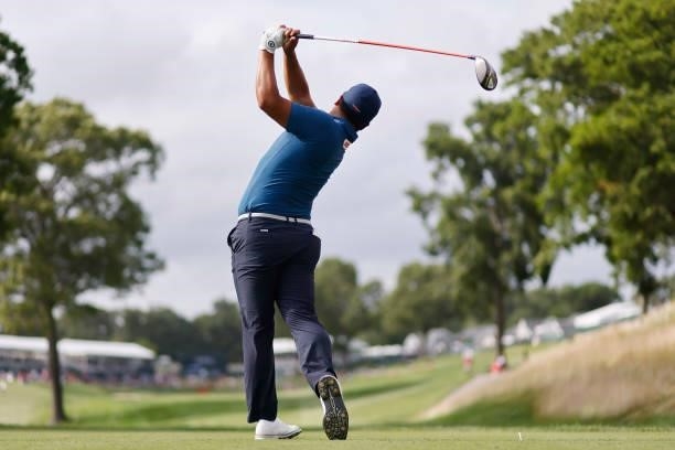 Lee of Korea plays his shot from the 18th tee during the third round of the Travelers Championship at TPC River Highlands on June 26, 2021 in...