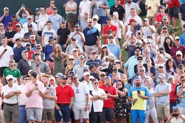 Fans look on from the 18th hole during the third round of the Travelers Championship at TPC River Highlands on June 26, 2021 in Cromwell, Connecticut.