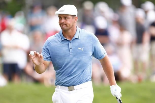 Bryson DeChambeau of the United States reacts to his putt on the seventh green during the third round of the Travelers Championship at TPC River...