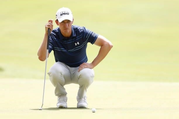 Maverick McNealy of the United States lines up a putt on the seventh green during the third round of the Travelers Championship at TPC River...
