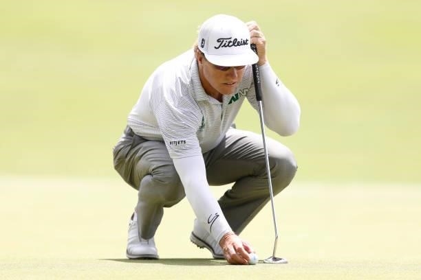 Charley Hoffman of the United States lines up a putt on the seventh green during the third round of the Travelers Championship at TPC River Highlands...
