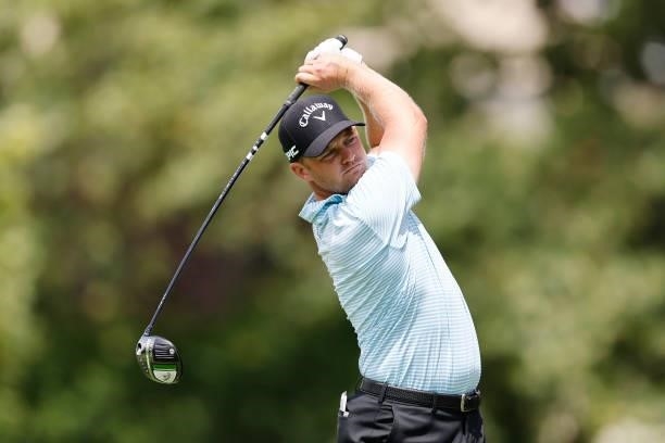 Tom Lewis of England plays his shot from the sixth tee during the third round of the Travelers Championship at TPC River Highlands on June 26, 2021...
