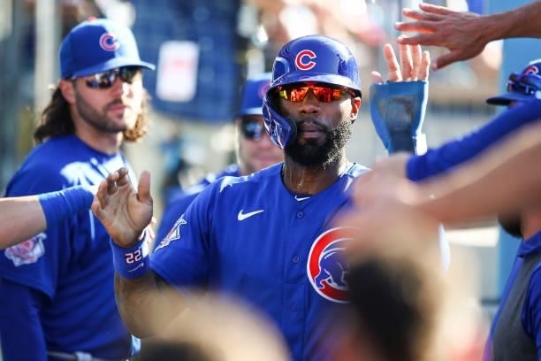 Jason Heyward of the Chicago Cubs celebrates his run with teammates in the dugout during the fifth inning against the Los Angeles Dodgers at Dodger...