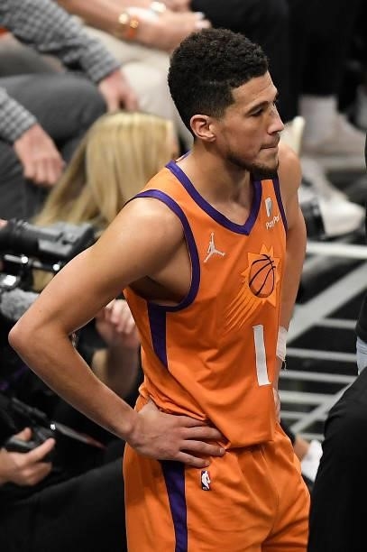 Devin Booker of the Phoenix Suns looks on against the LA Clippers during the second half in game four of the Western Conference Finals at Staples...
