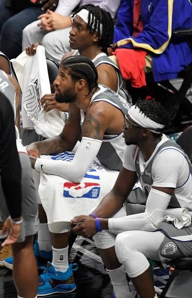 Paul George of the LA Clippers looks on from the bench during a timeout during the second half in game four of the Western Conference Finals against...