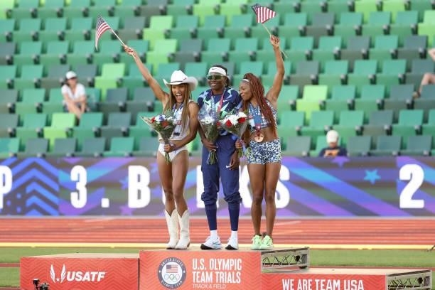 Brittney Reese , first, Tara Davis , second, and Quanesha Burks, third, celebrate on the podium after the Women's Long Jump Final on day nine of the...