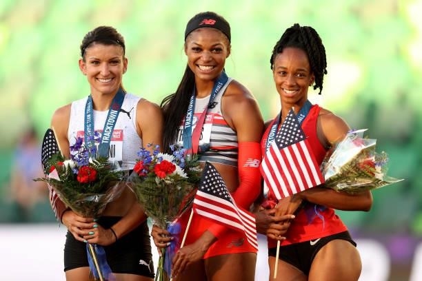 Gabby Thomas , first, Jenna Prandini , second, and Anavia Battle, third, celebrate on the podium after the Women's 200 Meters Final on day nine of...
