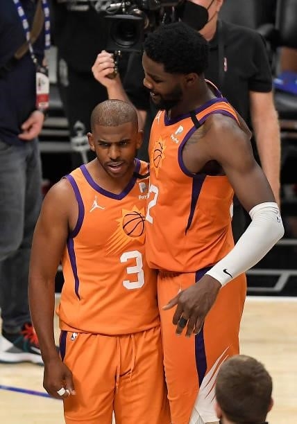 Chris Paul and Deandre Ayton of the Phoenix Suns celebrate a win against the LA Clippers in game four of the Western Conference Finals at Staples...