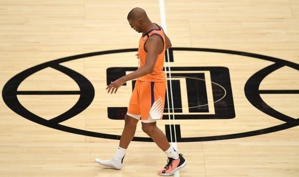 Chris Paul of the Phoenix Suns runs down court without a shoe against the LA Clippers during the second half in game four of the Western Conference...