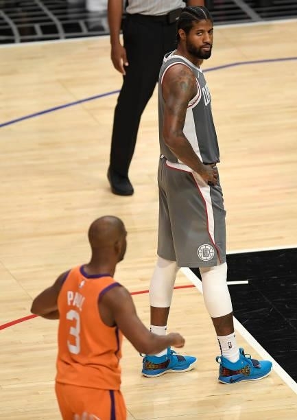 Paul George of the LA Clippers looks to Chris Paul of the Phoenix Suns after missing a foul shot during the second half in game four of the Western...