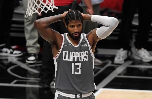 Paul George of the LA Clippers reacts in the final seconds of the team's loss against the Phoenix Suns during the second half in game four of the...