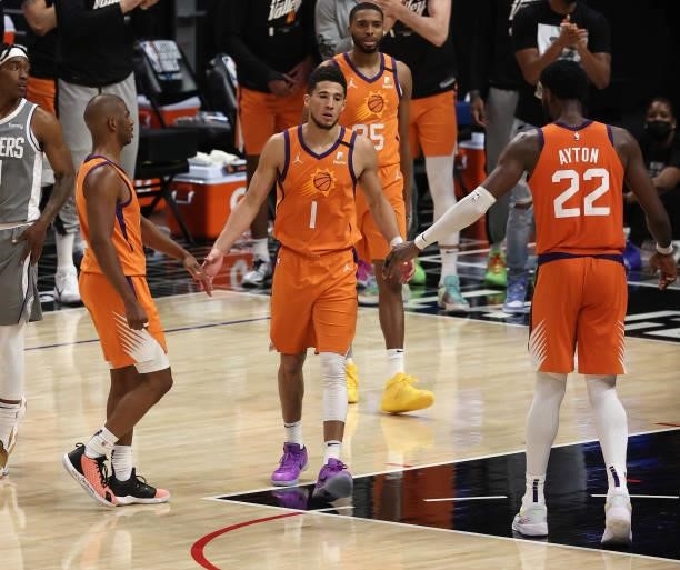 Devin Booker of the Phoenix Suns walks to the free throw line against the LA Clippers during the second half in game four of the Western Conference...