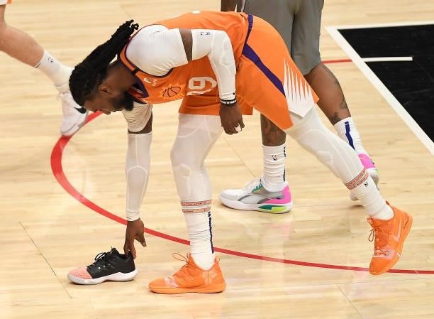 Jae Crowder of the Phoenix Suns picks up Chris Paul's shoe during the second half in game four of the Western Conference Finals at Staples Center on...