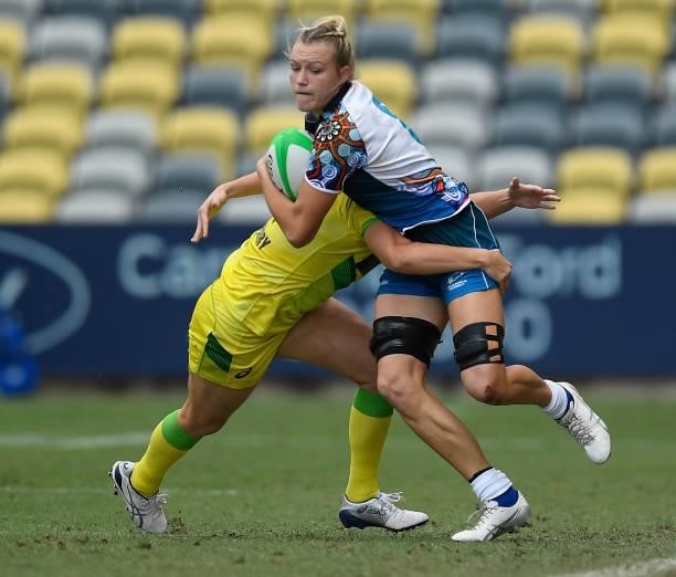 Maddison Levi of Oceania is tackled by Shannon Parry of Australia during the Oceania Sevens Challenge match between Australia and Oceania at...