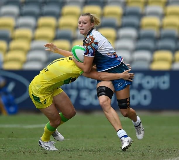 Maddison Levi of Oceania is tackled by Shannon Parry of Australia during the Oceania Sevens Challenge match between Australia and Oceania at...