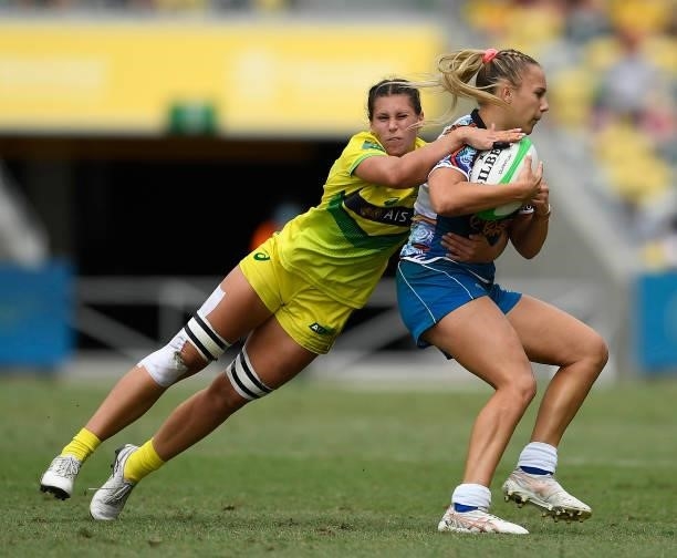 Teahan Levi of Oceania is tackled by Demi Hayes of Australia during the Oceania Sevens Challenge match between Australia and Oceania at Queensland...