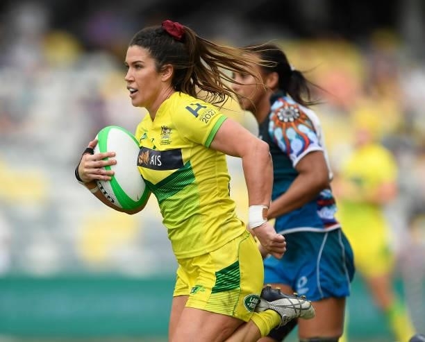 Charlotte Caslick of Australia runs to score a try during the Oceania Sevens Challenge match between Australia and Oceania at Queensland Country Bank...