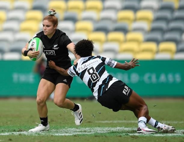 Michaela Blyde of New Zealand is tackled by Laisana Likuceva of Fiji during the Oceania Sevens Challenge match between New Zealand and Fiji at...