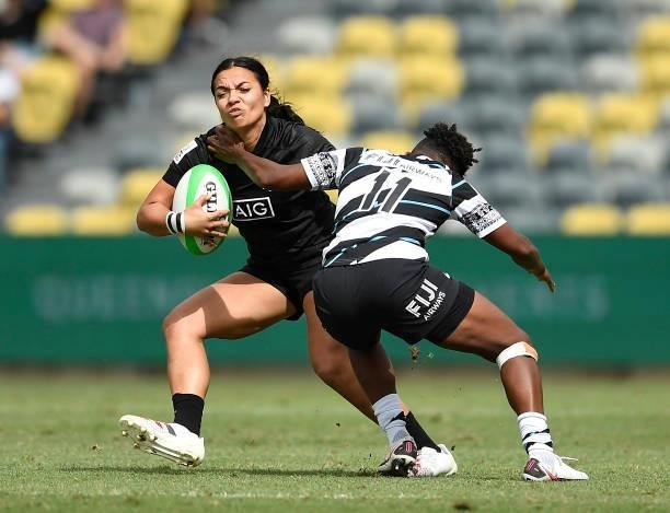 Stacey Waaka of New Zealand is tackled by Ana Naimasi of Fiji during the Oceania Sevens Challenge match between New Zealand and Fiji at Queensland...