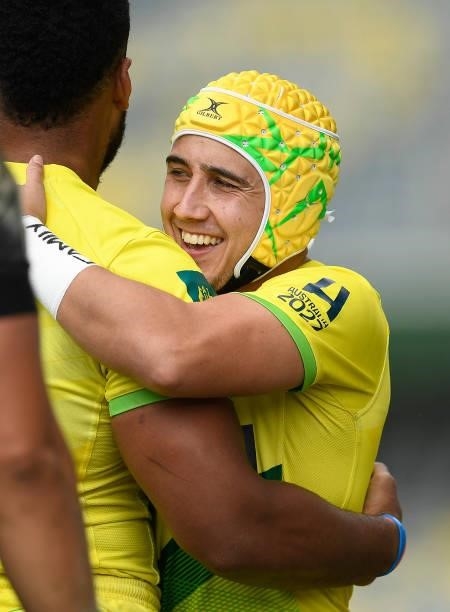 Josh Coward of Australia celebrates the try of Samu Kerevi during the Oceania Sevens Challenge match between New Zealand and Australia at Queensland...