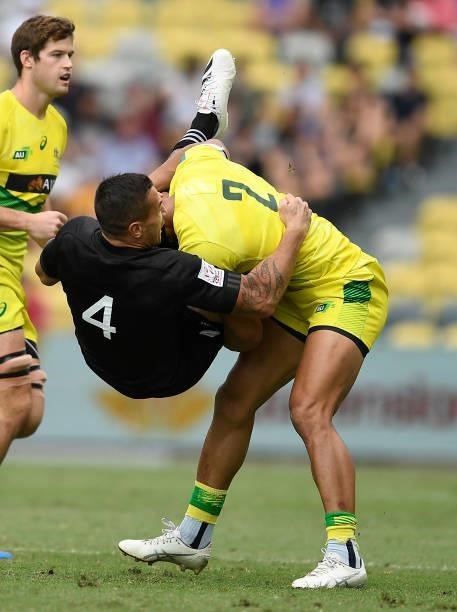 Trael Joass of New Zealand is tackled by Pama Fou of Australia during the Oceania Sevens Challenge match between New Zealand and Australia at...