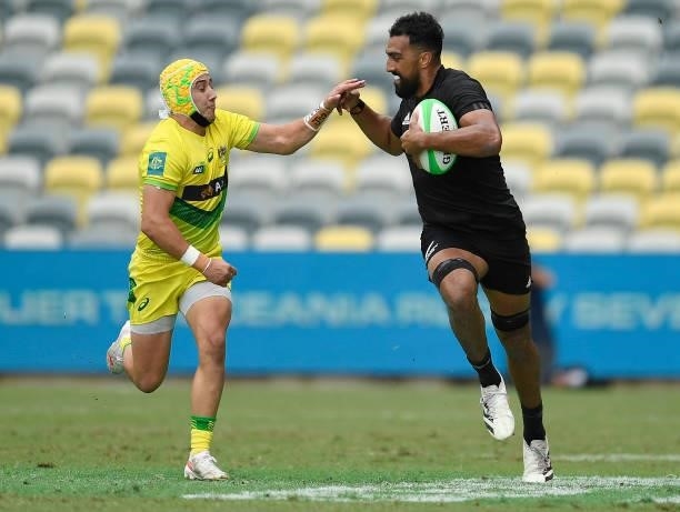 Amanaki Nicole of New Zealand attempts to get past Josh Coward of Australia during the Oceania Sevens Challenge match between New Zealand and...