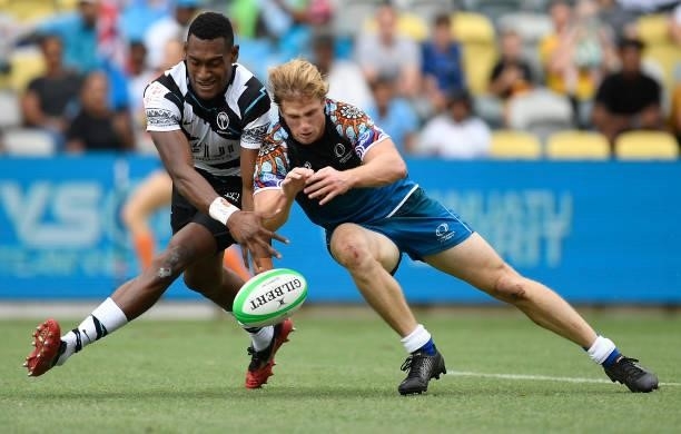 Angus Bell of Oceania contests the ball with Josefa Talacolo of Fiji during the Oceania Sevens Challenge match between Fiji and Oceania at Queensland...