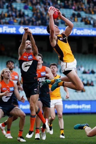 Jacob Koschitzke of the Hawks marks the ball during the round 15 AFL match between the Greater Western Sydney Giants and the Hawthorn Hawks at...