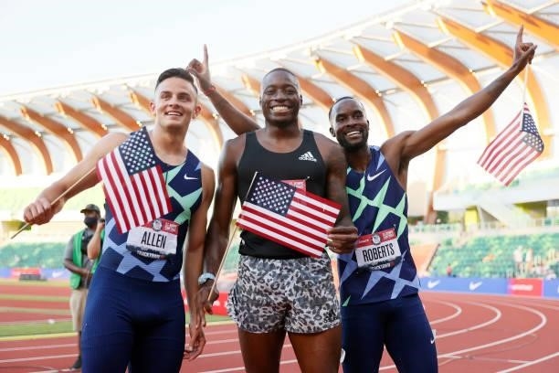 Grant Holloway , first, Devon Allen , second and Daniel Roberts, third, celebrate after the Men's 110 Meters Hurdle Final on day nine of the 2020...