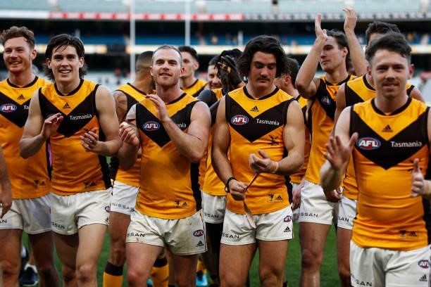 Tom Mitchell of the Hawks and teammates celebrate victory after the round 15 AFL match between the Greater Western Sydney Giants and the Hawthorn...