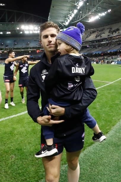Marc Murphy of the Blues walks from the ground with his child after the round 15 AFL match between the Carlton Blues and the Adelaide Crows at Marvel...