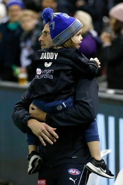 Marc Murphy of the Blues walks from the ground with his child after the round 15 AFL match between the Carlton Blues and the Adelaide Crows at Marvel...