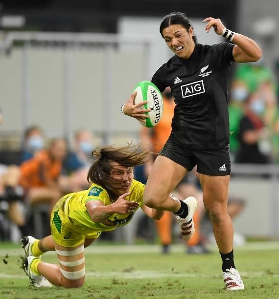 Stacey Waaka of New Zealand skips out of a tackle of Evania Pelite of Australia during the Oceania Sevens Challenge match between New Zealand and...