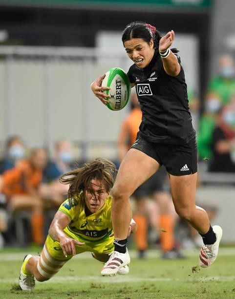 Stacey Waaka of New Zealand skips out of a tackle of Evania Pelite of Australia during the Oceania Sevens Challenge match between New Zealand and...