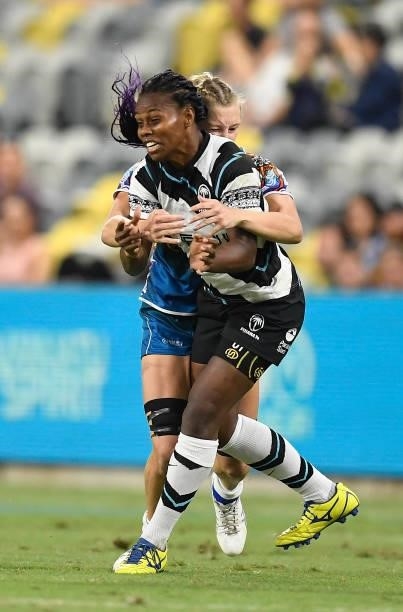 Raijeli Daveua of Fiji is tackled by Maddison Levi of Oceania during the Oceania Sevens Challenge match between Fiji and Oceania at Queensland...