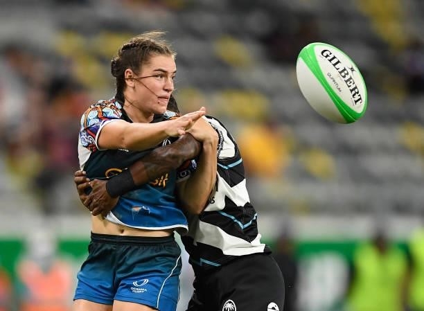 Jakiya Whitfeld of Oceania is tackled by Roela Radiniyavuna of Fiji during the Oceania Sevens Challenge match between Fiji and Oceania at Queensland...