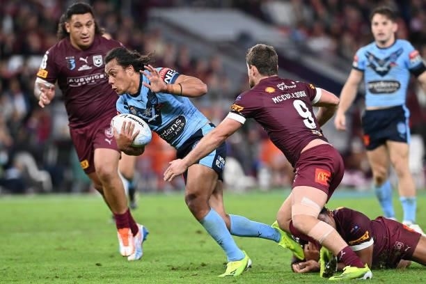 Jerome Luai of the Blues is tackled during game two of the 2021 State of Origin series between the Queensland Maroons and the New South Wales Blues...