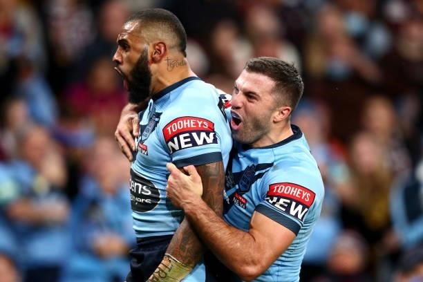 Josh Addo-Carr of the Blues celebrates after scoring a try with James Tedesco of the Blues during game two of the 2021 State of Origin series between...
