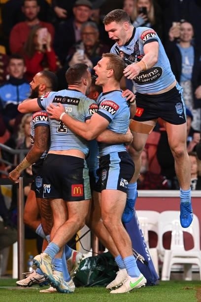 Josh Addo-Carr of the Blues celebrates with team mates after scoring a try during game two of the 2021 State of Origin series between the Queensland...