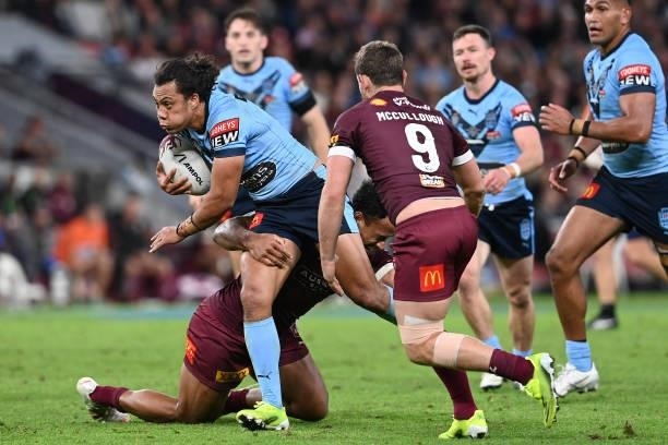 Jerome Luai of the Blues is tackled during game two of the 2021 State of Origin series between the Queensland Maroons and the New South Wales Blues...