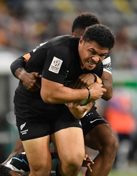 Caleb Clark of New Zealand is tackled during the Oceania Sevens Challenge match between New Zealand and Fiji at Queensland Country Bank Stadium on...