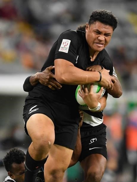 Caleb Clark of New Zealand is tackled during the Oceania Sevens Challenge match between New Zealand and Fiji at Queensland Country Bank Stadium on...