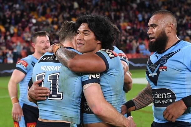 Brian To'o of the Blues and Cameron Murray of the Blues celebrate winning game two of the 2021 State of Origin series between the Queensland Maroons...