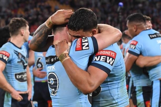 Latrell Mitchell of the Blues celebrates with Damien Cook of the Blues after winning game two of the 2021 State of Origin series between the...