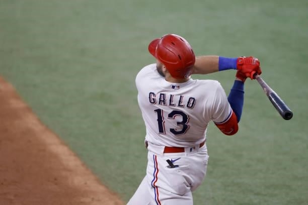 Joey Gallo of the Texas Rangers hits a three-run home run against the Kansas City Royals during the fourth inning at Globe Life Field on June 26,...
