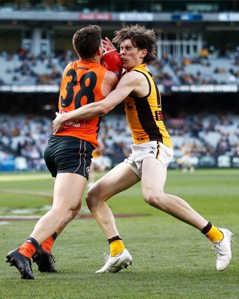 Daniel Lloyd of the Giants and Will Day of the Hawks contest the ball during the round 15 AFL match between the Greater Western Sydney Giants and the...