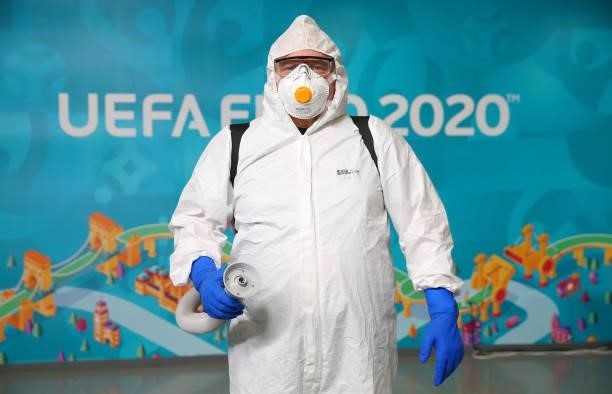 Member of staff disinfects the stadium prior to the UEFA Euro 2020 Championship Round of 16 match between Netherlands and Czech Republic at Puskas...