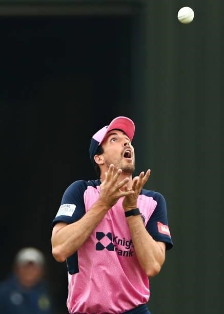 Steven Finn of Middlesex catches out Kiran Carlson of Glamorgan during the Vitality Blast T20 match between Middlesex and Glamorgan at Radlett...