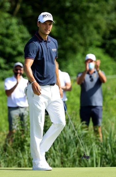 Martin Kaymer of Germany reacts after his putt on the 18th green during the final round of The BMW International Open at Golfclub Munchen Eichenried...