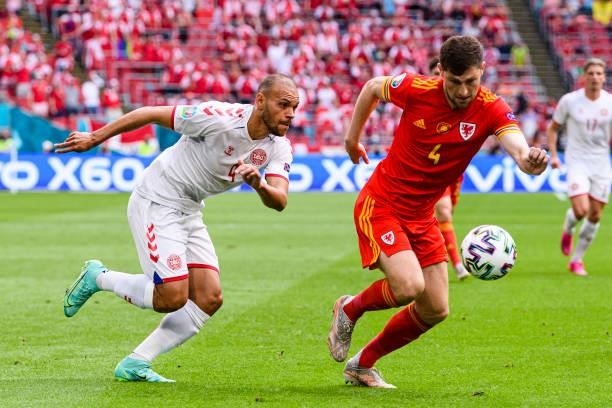 Martin Braithwaite of Denmark plays against Ben Davies of Wales during the UEFA Euro 2020 Championship Round of 16 match between Wales and Denmark at...